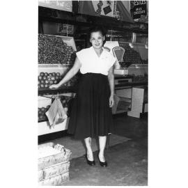 Dorothy Chun Tie (nee Huen) at the entrance to the fruit shop and cafe, Townsville, 1953