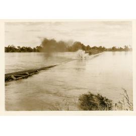 Engine B15, SC17 with driver Broderick (Ayr) and fireman Roy Cook (Bowen) crossing the flooded Burdekin River Railway Bridge, 21 March 1936