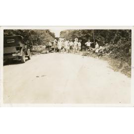 Family photograph from the Quelch Forno collection : Group of people and two utilities on the road, 30 January 1939