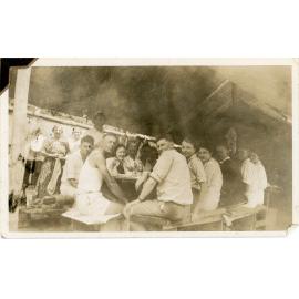 Family photograph from the Quelch Forno collection: Group of people sitting around a table, [Mount Spec, 1939]
