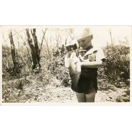 Family photograph from the Quelch Forno collection : boy with fish