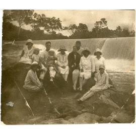 Family photograph from the Quelch Forno collection : Group photograph with a weir in the background