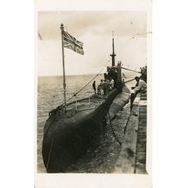 Submarine flying the Union Jack open to public viewing in the harbour