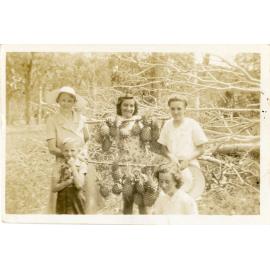 Family photograph from the Quelch Forno collection : Group of women and children with pineapples