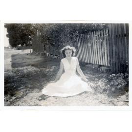 Family photograph from the Quelch Forno collection : Beryl Forno sitting on a footpath