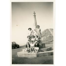 Family photograph from the Quelch Forno collection : Group of eight girls at the Robert Towns memorial on Castle Hill summit