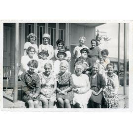 Family photograph from the Quelch Forno collection : Group of women posing for a photograph on a verandah