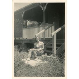 Beryl Forno posing for photograph on front stairs of a house, Townsville