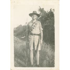 Family photograph from the Quelch Forno collection : Soldier in uniform holding a rifle fixed with bayonet