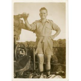 Family photograph from the Quelch Forno collection : Soldier posing beside large gun