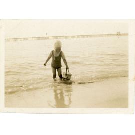 Family photograph from the Quelch Forno collection : child at the beach