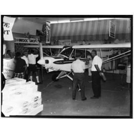 The Townsville Aero Club's new $14,000 Piper Super Cub plane in Woolworths store, Flinders Street, Townsville, 8/6/1969