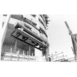 Air conditioning unit being installed into the Hotel Townsville, Flinders Street, 1974