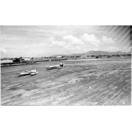 Light aircraft at Garbutt airport, Townsville, 1977