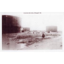 Beverly Ann Marsh with her Grandfather at the oil tanks on salt flats next to 32 Twelfth Avenue, Railway Estate, Townsville, 1940's