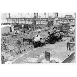 Overturned truck crane, Hotel Townsville site, 1974