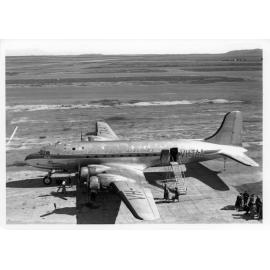 Passengers boarding a Trans Australia Airways (TAA) plane at Garbutt airport, Townsville, 1950