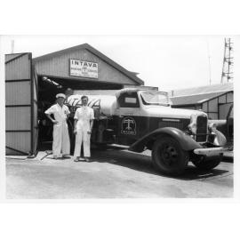 Intava Aviation Service refuelling truck and shed, Garbutt airport, Townsville, 1948
