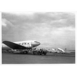 Refuelling a plane on the tarmac, Garbutt airport, Townsville, 1956