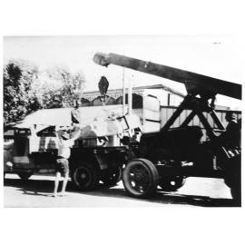 Removing a demolished air raid shelter, Blackwood Street, Townsville, August 1945