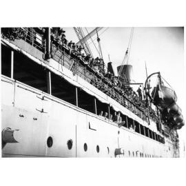 Troops of the 5th Australian Army Division arrive in Townsville on the 25th March 1945 from New Guinea aboard HMT Katoomba for home leave