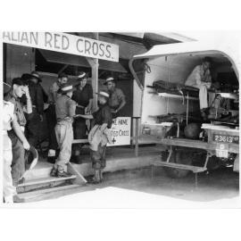 Stretcher cases evacuated from the 2/7 Australian General Hospital by 1st Medical Air Evacuation Transport Unit at Garbutt Airport, 26 November 1945