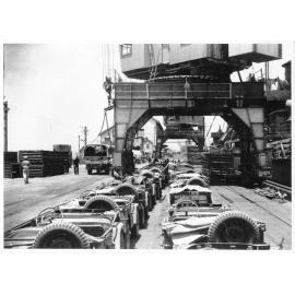 Jeeps of the 1st Australian Army Transport on the wharf at Townsville ready to be loaded on the Liberty Ship SS James Oliver for shipment to Lae, New Guinea, 18 October 1944