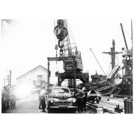 A car belonging to 1st Australian Army Transport being prepared for loading aboard the Liberty ship, SS James Oliver for shipment to Lae, New Guinea, 18 October 1944