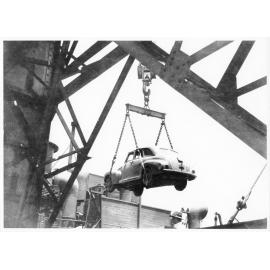 A car belonging to 1st Australian Army Transport being hoisted aboard the Liberty ship, SS James Oliver for shipment to Lae, New Guinea, 18 October 1944