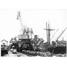 Vehicles belonging to 1st Australian Army Transport waiting to be loaded aboard the Liberty ship, SS James Oliver at Townsville, for shipment to Lae, New Guinea, 18 October 1944