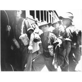 Members of the 24th Aust. Inf. Bde. boarding a train to the Atherton Tablelands after their arrival in Townsville on 28/1/44 after taking part in action for several months in the Finschhafen area of New Guinea