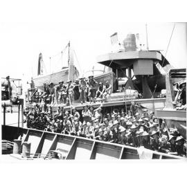 Members of the 24th Aust. Inf. Bde. on their arrival in Townsville on 28/1/44 after fighting in the Finschhafen area, New Guinea