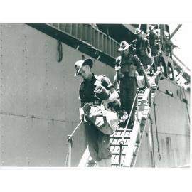 Troops, 24th Aust. Inf. Bde. disembarking at Townsville on 28/1/44 after many months of fighting in the Finschhafen area of New Guinea