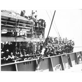 Members of the 24th Aust. Inf. Bde. arrive in Townsville 28/1/44 after many months of fighting in the Finschhafen area of New Guinea