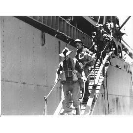 Members of the 24th Aust. Inf. Bde. disembark at Townsville 28.1.44 after many months of fighting in the Finschhafen area, New Guinea