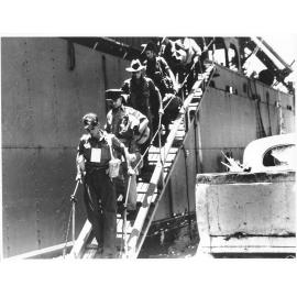 Members of the 24th Aust. Inf. Bde. disembarking at Townsville on 28/1/44 after many months fighting in the Finschhafen area of New Guinea