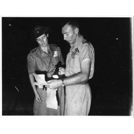 Checking movement orders, Garbutt Airport, 2nd April, 1945
