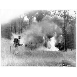 Portable flame thrower being demonstrated in Townsville, 1943
