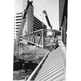 [Erecting the viaduct between the Hotel Townsville and the Ogden Street carpark, Townsville] 1976