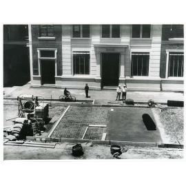 Building a concrete road in front of the Commonwealth Bank of Australia, Flinders Street, Townsville, 1928. 