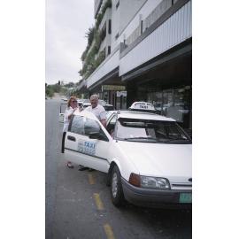 Standard White Taxis and drivers in the taxi rank on Stokes Street, Townsville, 1991