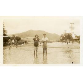 Herbie Low and friend standing in floodwater during the 1946 Townsville flood