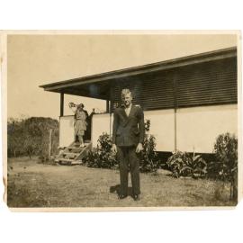 George Anderson posing for a photograph, with Alma and Zena on the steps