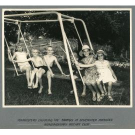 Youngsters enjoying the swings at Bluewater provided [by] Mundingburra Rotary Club