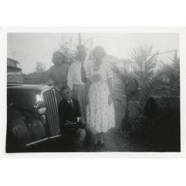 Family photograph from the Quelch Forno collection: Mr and Mrs Forno, Beryl and Ray beside the car