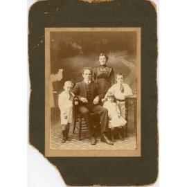 Family photograph from the Quelch Forno collection : Studio portrait of a couple with three children