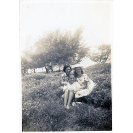Family photograph from the Quelch Forno collection : Two women and a girl posing outdoors for a photograph