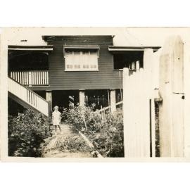 Beryl Forno in the front yard at home, 31 China Street, Mundingburra, Townsville, ca. 1935