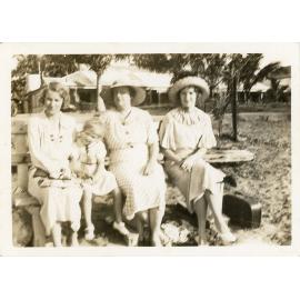 Family photograph from the Quelch Forno collection: three women and a child posing for a photograph