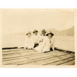 Family photograph from the Quelch Forno collection : People sitting on a jetty at Horseshoe Bay, Magnetic Island